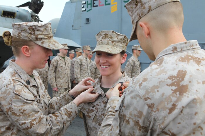 Sgt. Rebecca Allor, a Heartland Mich., native with the Command Element, 24th Marine Expeditionary Unit, is promoted to her current rank of Sergeant in the US Marine Corps during a ceremony  aboard the USS Iwo Jima (LHD 7), Oct 1, 2012.  The 24th MEU is deployed with the Iwo Jima Amphibious Ready Group as a theater reserve force for U.S. Central Command and is providing support for maritime security operations and theater security cooperation efforts in the U.S. Navy's 5th Fleet area of responsibility. (U.S. Marine Corps photo by Gunnery Sgt. Chad R. Kiehl)