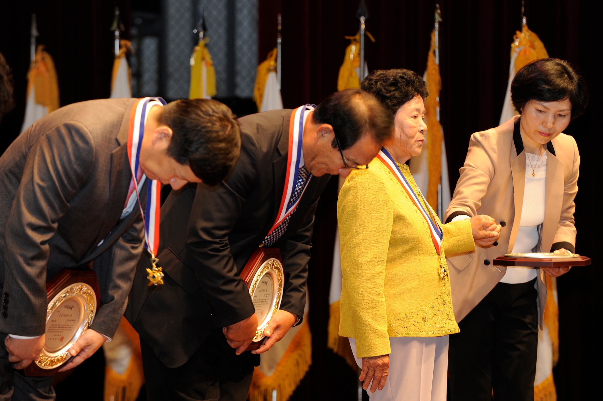 Citizens of Gunsan City receive outstanding citizen awards during Gunsan City Citizens Appreciation Day at Gunsan City, Republic of Korea, Oct. 5, 2012. The citizens awarded this honor were selected from each town and chosen for their dedication to their city. (U.S. Air Force photo/Senior Airman Marcus Morris)
