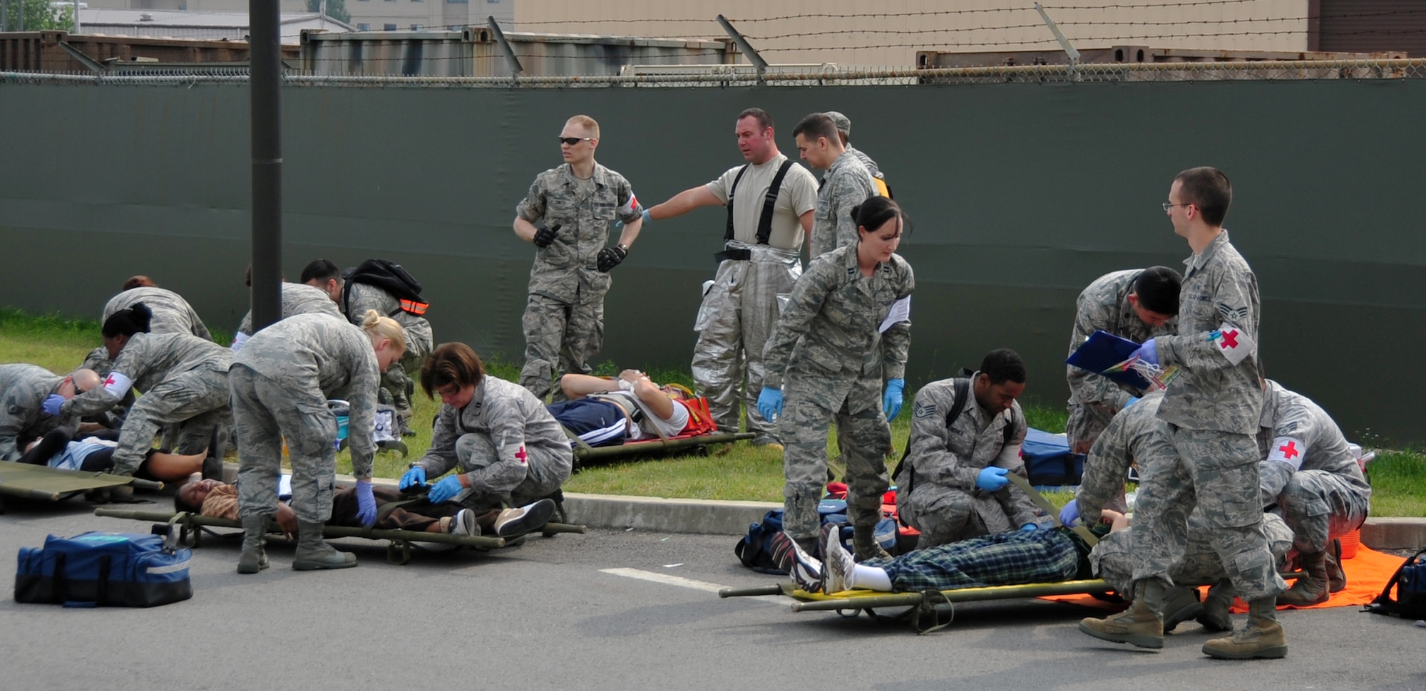 First responders from the 51st Medical Operations Squadron triage injured patients following a simulated aircraft crash at Osan Air Base, Republic of Korea, Oct. 5, 2012. The crash was part of an emergency management exercise in preparation for the base’s Air Power Day 2012. (U.S. Air Force photo/Staff Sgt. Craig Cisek)
