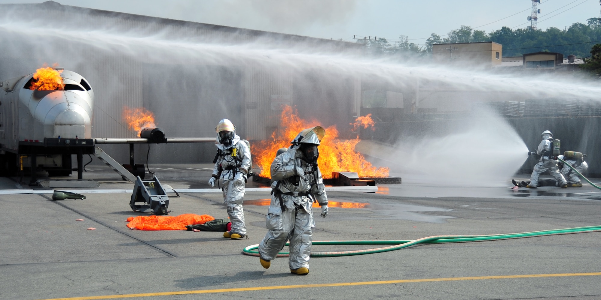 Firefighters from the 51st Civil Engineer Squadron extinguish a fire started by a simulated aircraft crash at Osan Air Base, Republic of Korea, during an emergency management exercise Oct. 5, 2012. (U.S. Air Force photo/Staff Sgt. Craig Cisek)