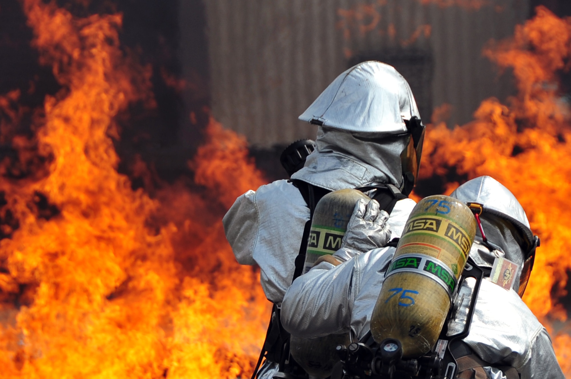 Firefighters from the 51st Civil Engineer Squadron extinguish a fire started by a simulated aircraft crash at Osan Air Base, Republic of Korea, during an emergency management exercise Oct. 5, 2012. (U.S. Air Force photo/Staff Sgt. Craig Cisek)