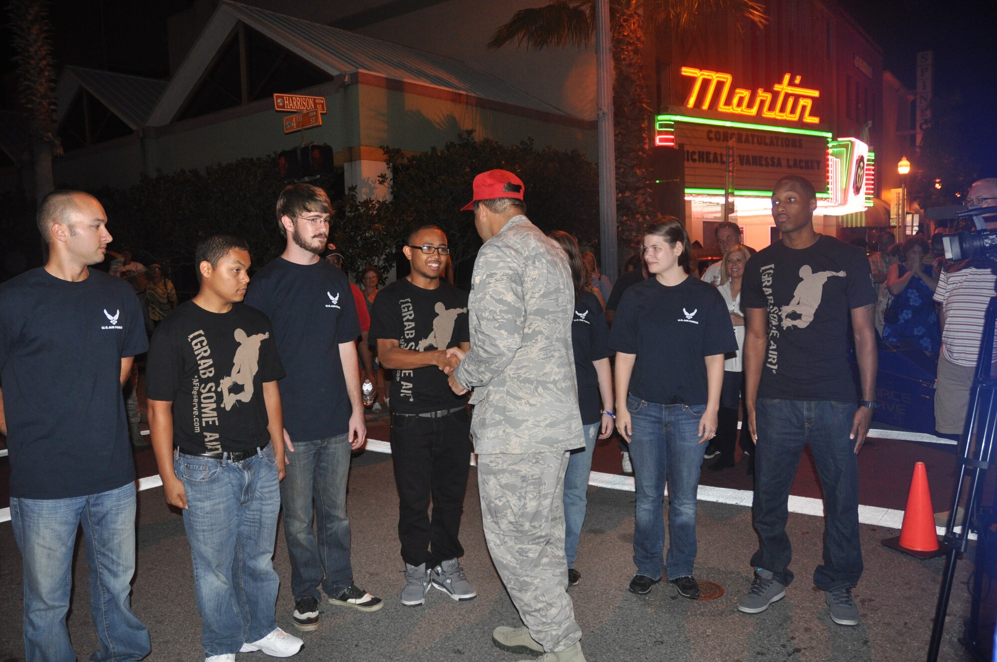 Twelve Panhandle residents took the oath of enlistment surrounded by their families and friends in front of the Martin Theater in downtown Panama City Friday. (U.S. Air Force photo by 2nd Lt. Andrea Valencia)