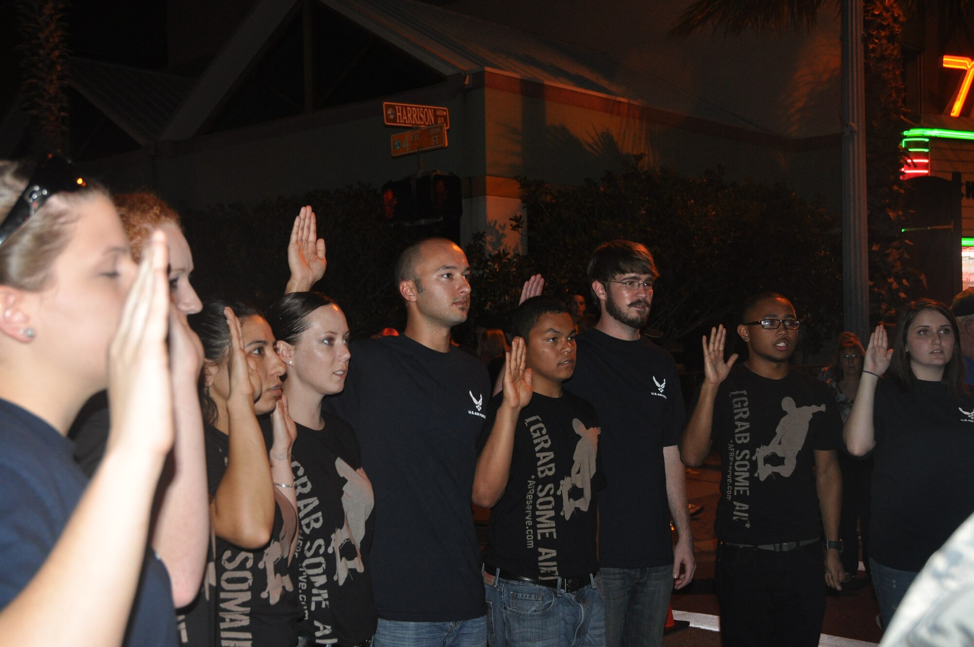 Twelve Panhandle residents took the oath of enlistment surrounded by their families and friends in front of the Martin Theater in downtown Panama City Friday. (U.S. Air Force photo by 2nd Lt. Andrea Valencia)
