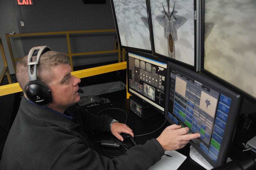 Glen Stallard, 22nd Operation Support Squadron KC-135 Stratotanker boom instructor operates the instructor console during a mock air refueling procedure in the Boom Operator Weapon System Trainer Oct. 9, 2012, McConnell Air Force Base, Kan. The BOWST is used to train boom operators for real-world operations while saving money and flying hours. (U.S. Air Force photo/ Airman 1st Class Maurice Hodges)