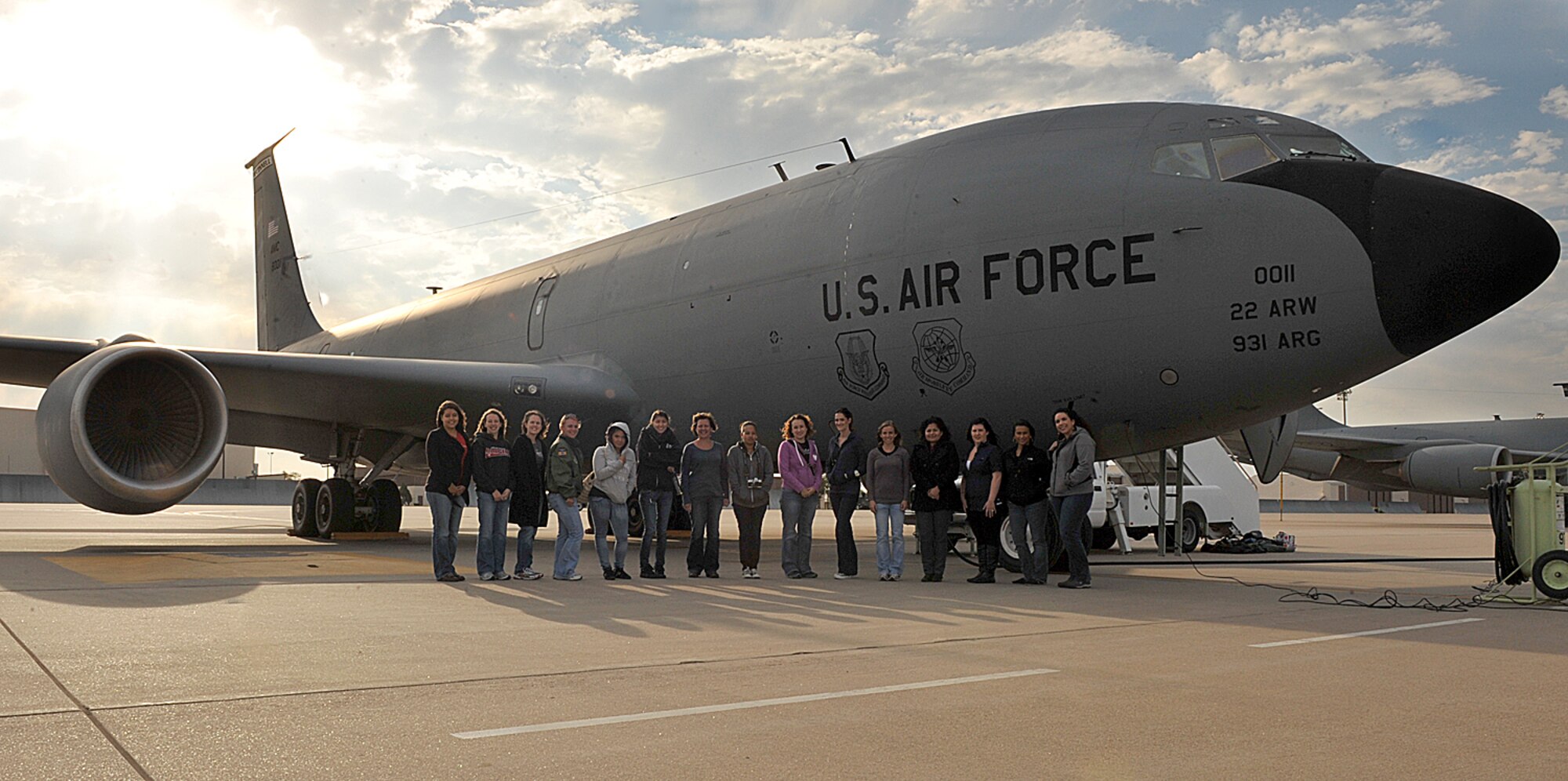 Fifteen spouses from the 22nd Operations Group pose for a group photo before an orientation flight Oct. 4, 2012, McConnell Air Force Base, Kan. The spouses went on a four hour flight to experience a KC-135 Stratotanker refuel another KC-135 over the Midwest. (U.S. Air Force photo/Airman 1st Class Maurice A. Hodges)