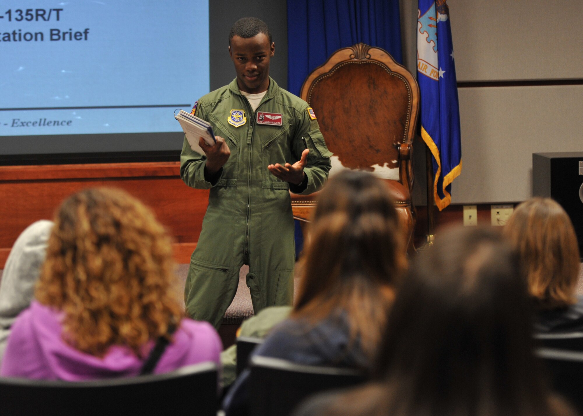 Airman 1st Class James Walker, 384th Air Refueling Squadron boom operator, briefs about the emergency procedures while on a KC-135 Stratotanker Oct. 4, 2012, McConnell Air Force Base, Kan. Fifteen spouses from the 22nd Operations Group flew on an orientation flight to witness the 22nd Air Refueling Wing’s mission. (U.S. Air Force photo/Airman 1st Class Maurice A. Hodges)