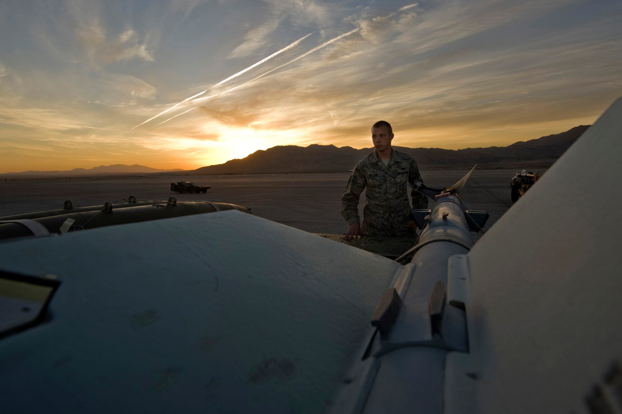 U.S. Air Force Senior Airman Karl Nielson, 57th Aircraft Maintenance Squadron weapons load crew member, inspects munitions before taking part in a quarterly load crew competition Oct. 5,2012, at Nellis Air Force Base, Nev. Load crew competitions take place four times a year, as well as a fifth competition which is for the title of load crew of the year. The competitions give different aircraft squadrons the opportunity to display their skills to the wing commander. (U.S. Air Force photo by Senior Airman Daniel Hughes)
