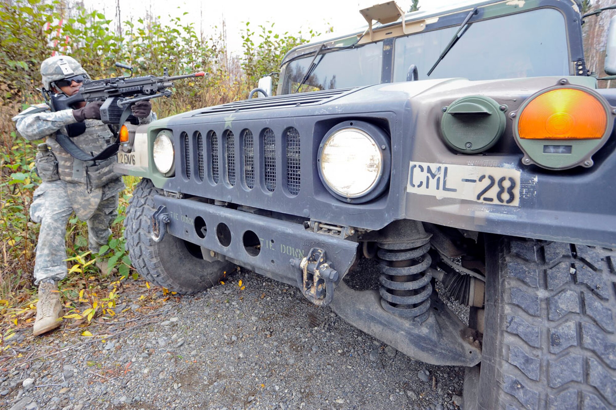 JOINT BASE ELMENDORF-RICHARDSON, Alaska ? Spc. Elijah Mbugua, 95th Chemical Company, 6th Engineer Battalion, of Irving, Texas, conducts perimeter security during battle drills at the Infantry Squad Battle Course, JBER-Richardson, September 25, 2012.  The small unit?s ability to accomplish its mission often depends on the Soldiers? ability to execute key actions quickly with minimal leader commands.  During the exercise, Soldiers were exposed to various scenarios requiring them to react to contact, react to ambush, react to and report improvised explosive devices, and interact with local indigenous personnel, to include key leader engagements.  (U.S. Air Force photo/Percy G. Jones)