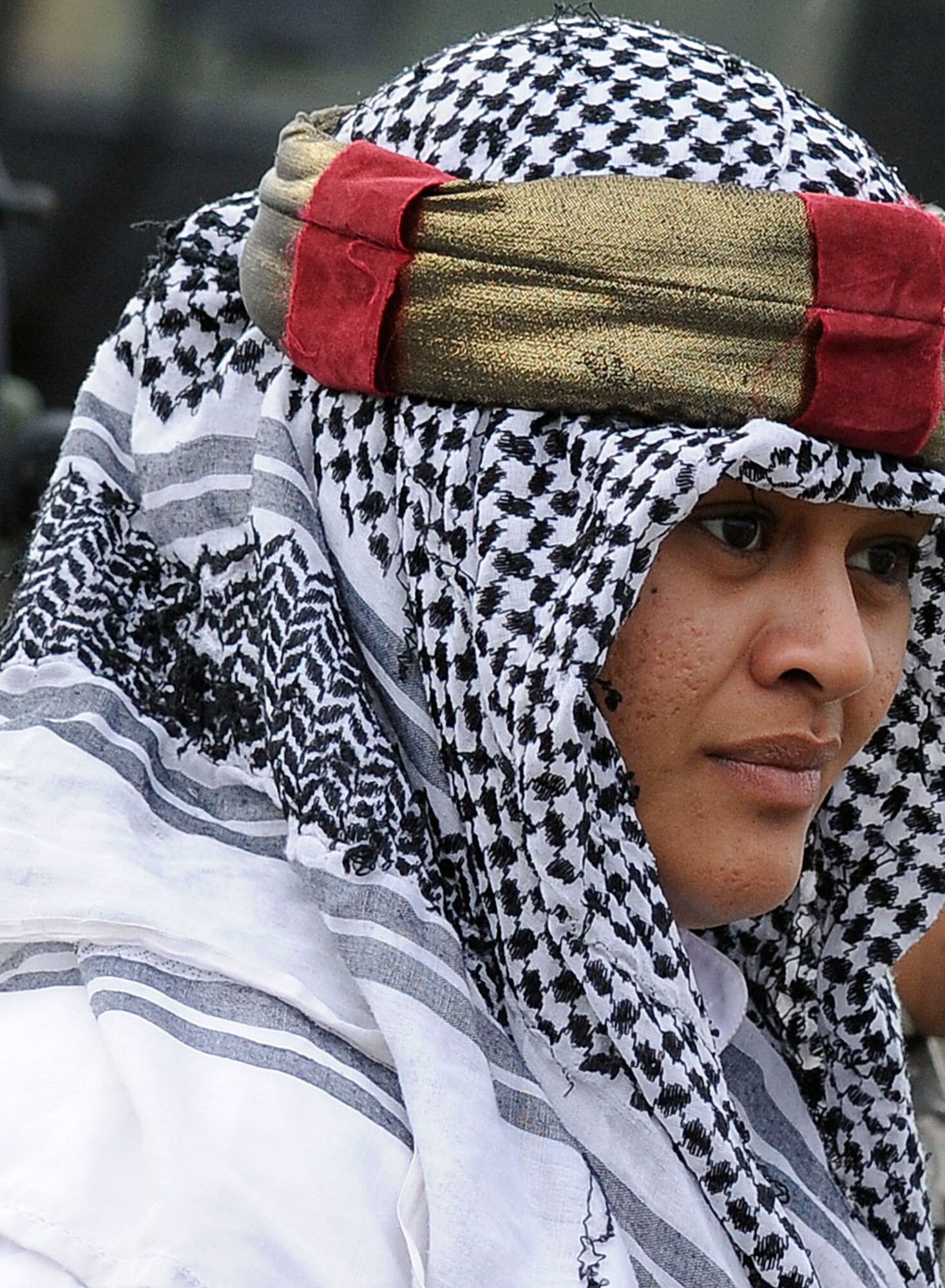 JOINT BASE ELMENDORF-RICHARDSON, Alaska ? Spc. Bertha Harrell, 95th Chemical Company, 6th Engineer Battalion, of Waipahu, Hawaii, portrays an "insurgent" during conduct battle drills at the Infantry Squad Battle Course, JBER-Richardson, September 25, 2012.  The small unit?s ability to accomplish its mission often depends on the Soldiers? ability to execute key actions quickly with minimal leader commands.  During the exercise, Soldiers were exposed to various scenarios requiring them to react to contact, react to ambush, react to and report improvised explosive devices, and interact with local indigenous personnel, to include key leader engagements.  (U.S. Air Force photo/Percy G. Jones)