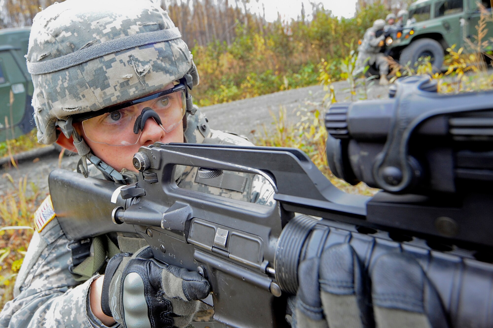 JOINT BASE ELMENDORF-RICHARDSON, Alaska ? Pvt. Andrew Widell, 95th Chemical Company, 6th Engineer Battalion, of Grantsburg, Wis., pulls perimeter security during battle drills at the Infantry Squad Battle Course, JBER-Richardson, September 25, 2012.  The small unit?s ability to accomplish its mission often depends on the Soldiers? ability to execute key actions quickly with minimal leader commands.  During the exercise, Soldiers were exposed to various scenarios requiring them to react to contact, react to ambush, react to and report improvised explosive devices, and interact with local indigenous personnel, to include key leader engagements.  (U.S. Air Force photo/Percy G. Jones)