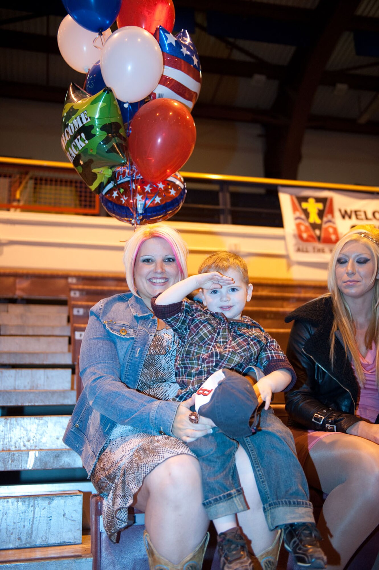 Katie Medina waits with her son, Anthony, 2, for her husband, Army Staff Sgt. Mark Medina's return Sept. 27 at the Buckner Physical Fitness Center on JBER Sept. 27 after a 10-month deployment in support of Operation Enduring Freedom. Medina is one of 300 members of the 4th Brigade Combat Team (Airborne), 25th Infantry Division that returned home that day. Katie is the 1-40 Cavalry Family Readiness Group leader, considered a resource for families. Her hometown is Stanford, Ky. (U.S. Air Force photo/Staff Sgt. Robert Barnett)