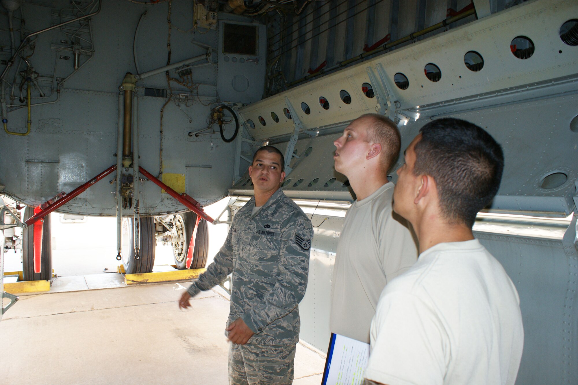 Staff Sgt. Eric Alaniz, 362nd Training Squadron B-52H crew chief instructor (left), discusses aircraft nomenclature with students at Sheppard Air Force Base, Texas, Oct. 1, 2012.  Safety procedures is always a focus during aircraft maintanance training. (U.S. Air Force photo/Dan Hawkins)