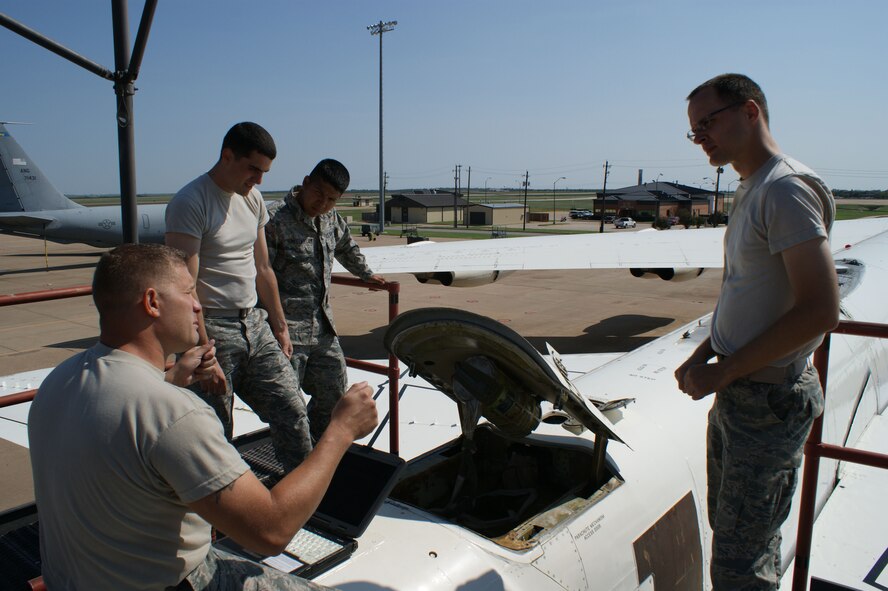 Tech. Sgt. Brian Anderson (foreground), 362nd Training Squadron B-52H Stratofortress crew chief instructor, demonstrates drag chute operations with students at Sheppard Air Force Base, Texas, Oct. 1, 2012.  Aircraft maintainers are taught to think safety from the very first day of training. (U.S. Air Force photo/Dan Hawkins)