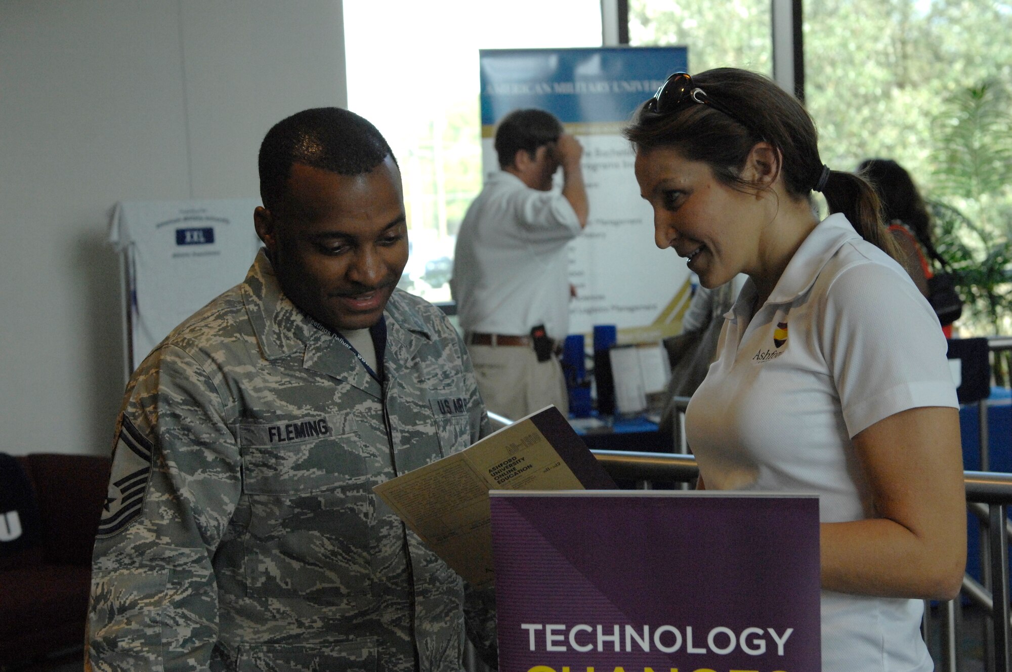 Senior Master Sgt. Rashaun Fleming, 20th Operations Support Squadron airfield manager, speaks to Kathryn Looney, Ashford's military liaison, during an education fair at Shaw Air Force Base, S.C., Oct. 2, 2012. Ashford, along with the other nine colleges at the fair, had educational opportunities for not only active and retired military members, but also their dependents. (U.S. Air Force photo by Airman 1st Class Krystal M. Jeffers/Released)

