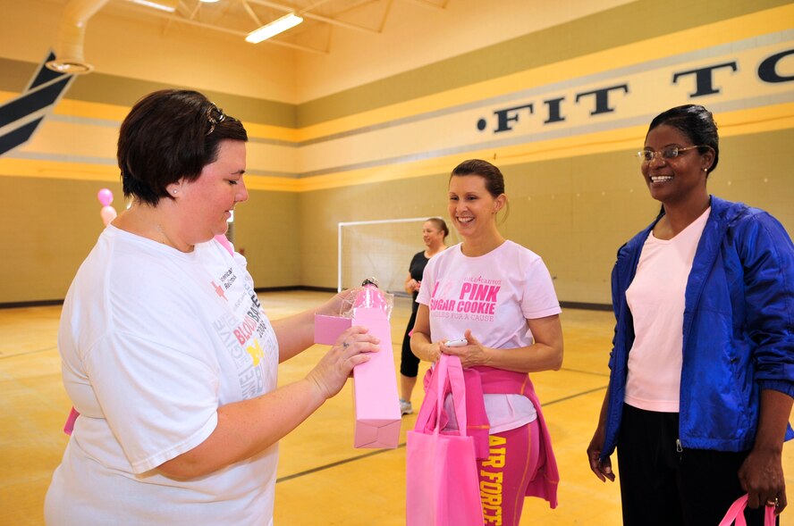 U.S. Air Force Airmen win prizes from a raffle at the annual breast cancer awareness walk at the fitness center, Shaw Air Force Base, S.C., Oct. 2, 2012.  The event was held by the Health and Wellness Center along with the 20th Medical Group.  More than 100 people participated in the walk. (U.S. Air Force photo by Airman Nicole Sikorski/Released)
