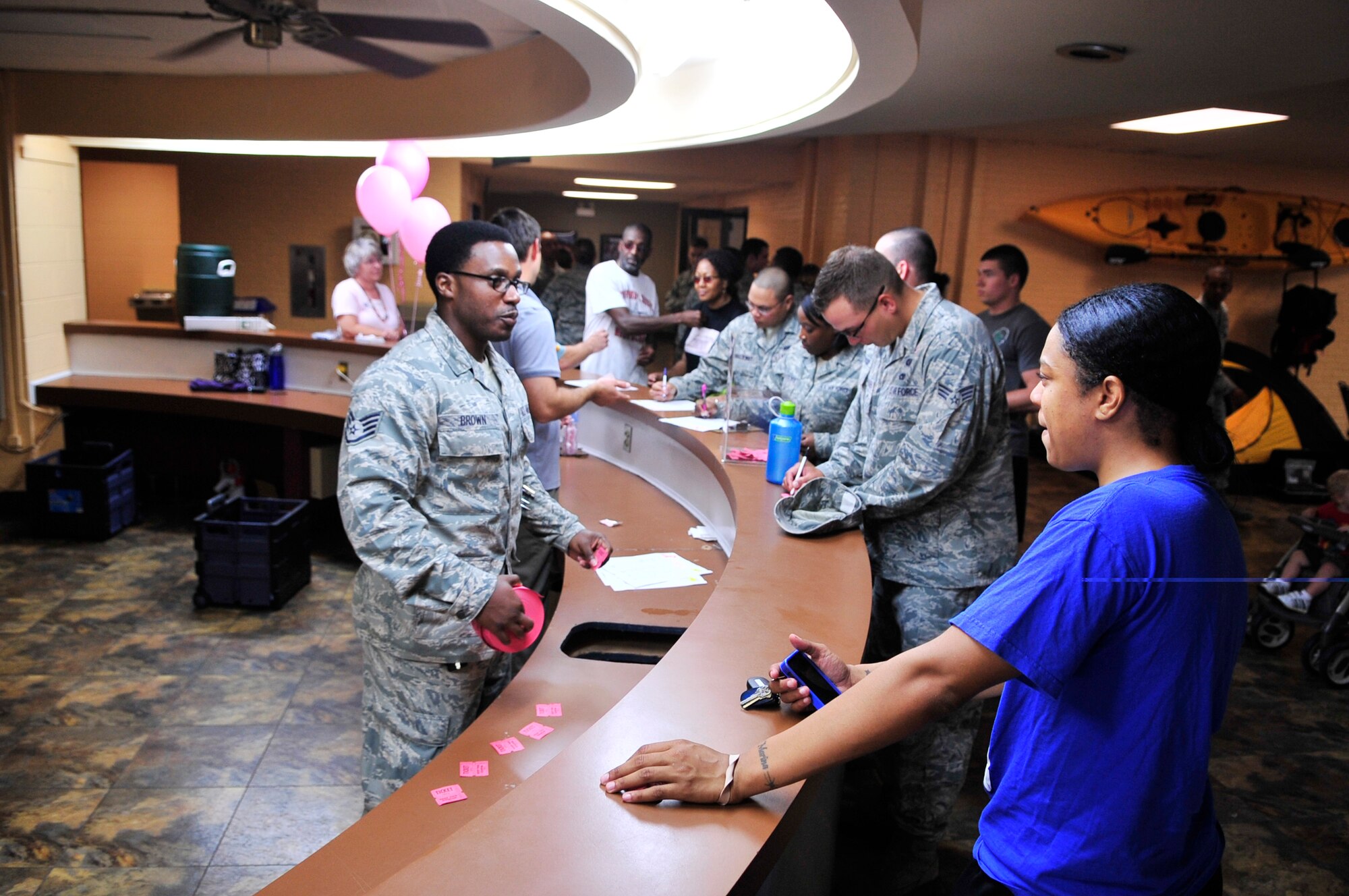 U.S. Air Force Airmen register for the annual breast cancer awareness walk at the fitness center, Shaw Air Force Base, S.C., Oct. 2, 2012.  The event was held by the Health and Wellness Center along with the 20th Medical Group.  More than 100 people participated in the walk. (U.S. Air Force photo by Airman Nicole Sikorski/Released)
