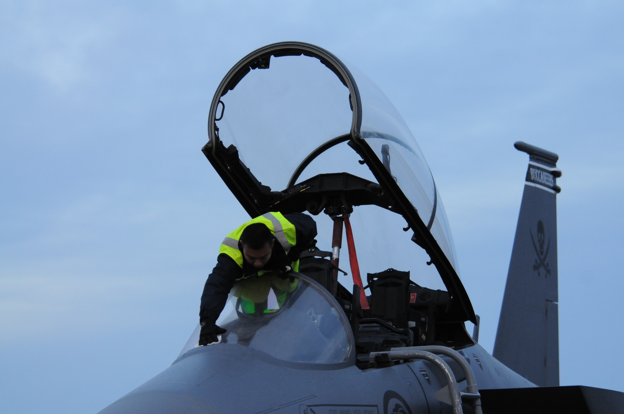ME1 Jun Long Tan, 428th Fighter Squadron flight line crew chief, wipes frost off the window of a Republic of Singapore F-15SG Oct. 5, 2012, at Eielson Air Force Base, Alaska. The 428th FS from Mountain Home Air Force Base, Idaho, is participating in the annual RED FLAG-Alaska 13-1 exercise.     (U. S. Air Force photo/Senior Airman Benjamin Sutton)