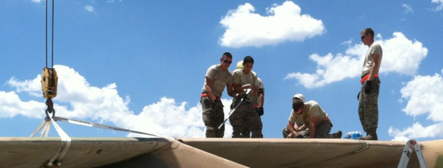 Airmen from the 7th Equipment Maintenance Squadron remove rivets connecting an RB-66’s wing to its body during the restoration of the aircraft Aug. 21, 2012, at Dyess Air Force Base, Texas. Once restored, the RB-66 will be displayed in the Dyess Linear Airpark. (U.S. Air Force photo by Airman 1st Class Peter Thompson/ Released)