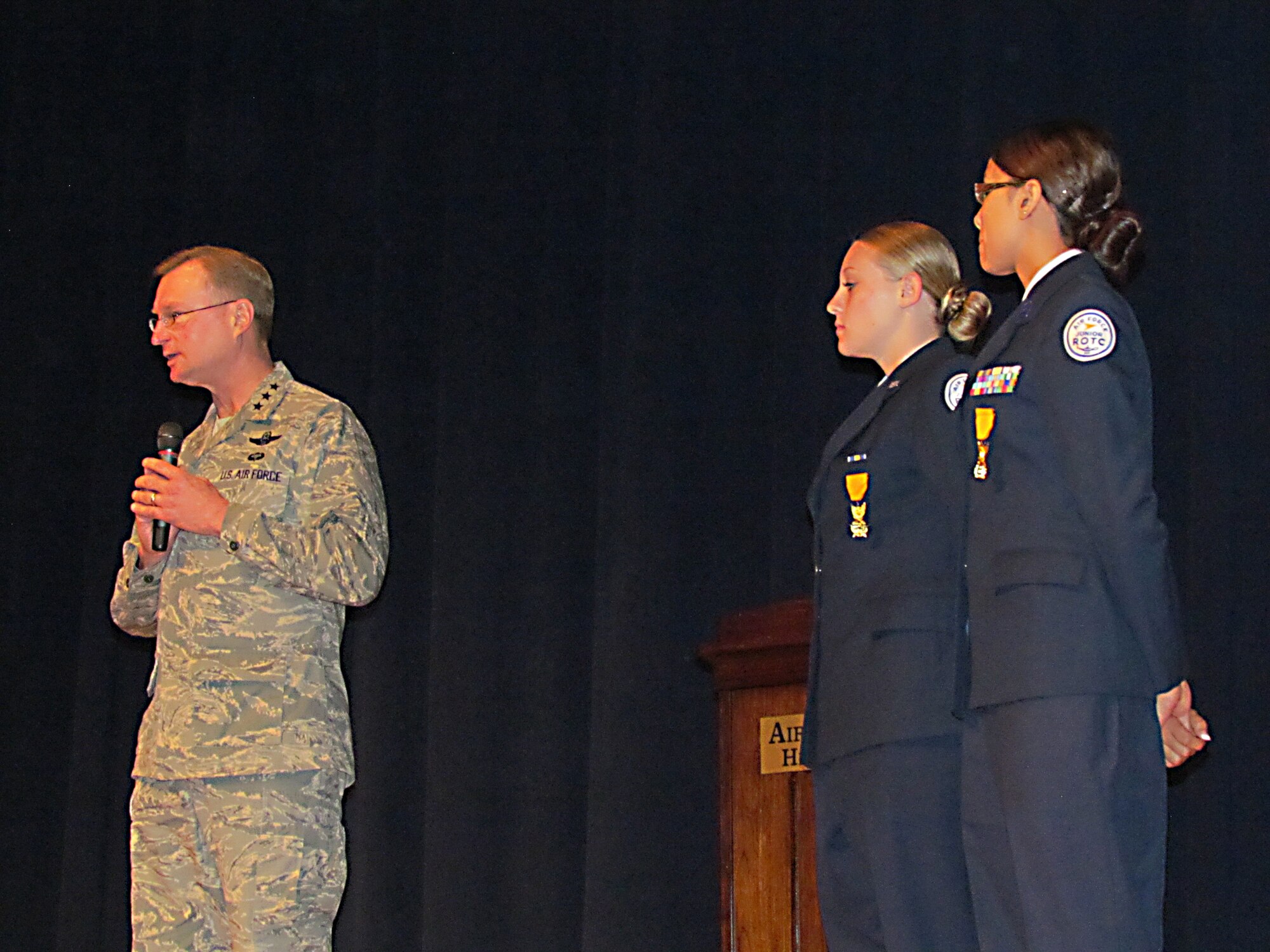 Lt. Gen. David Fadok, Air University commander and president, addresses an
assembly following his presentation of the Air Force JROTC Award of Valor to
Cadets Erin Post and Julia Nguyen Oct. 5. The cadets received the award for
their actions following the movie theater shootings in Aurora, Colo., in
July. The cadets, students at Aurora Central High School, rendered
life-saving aid to victims of the shooting until emergency response
personnel arrived on scene. (Courtesy photo) 

