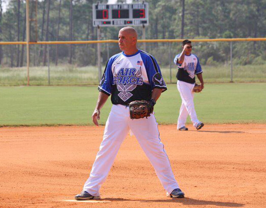 Master Sgt. Tony Patrick warms up prior to an Air Force men's softball game. (Courtesy photo)  
