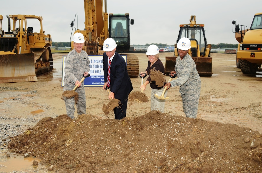 (L to R) U.S. Air Force Brig. Gen. Scott Kelly, 175th Wing Commander, Mr. David Costello from Costello Construction Company, Ms. Barbara Nemchek from Burns & McDonnell Design Firm and U.S. Air Force Brig. Gen. Allyson Solomon, Assistant Adjutant General–Air, break ground on our new facility at Warfield Air National Guard Base, Baltimore, Maryland on October 2, 2012.  This new 31,500 Square Foot Facility is designed to house the 175th Wing Headquarters, Mission Support Group and Medical Group missions.  This facility has a projected cost $11.8 million, and features multiple green roofs and is anticipated to achieve certified LEED Silver status with the numerous energy enhancement measures upon its completion anticipated completion in June 2014.

Functional areas include offices, medical/dental examination and treatment space, classrooms, administration space, command section, conference rooms, telephone switching/data automation center as well as utility systems services and connections. (National Guard photo by Senior Master Sgt. Ed Bard)

