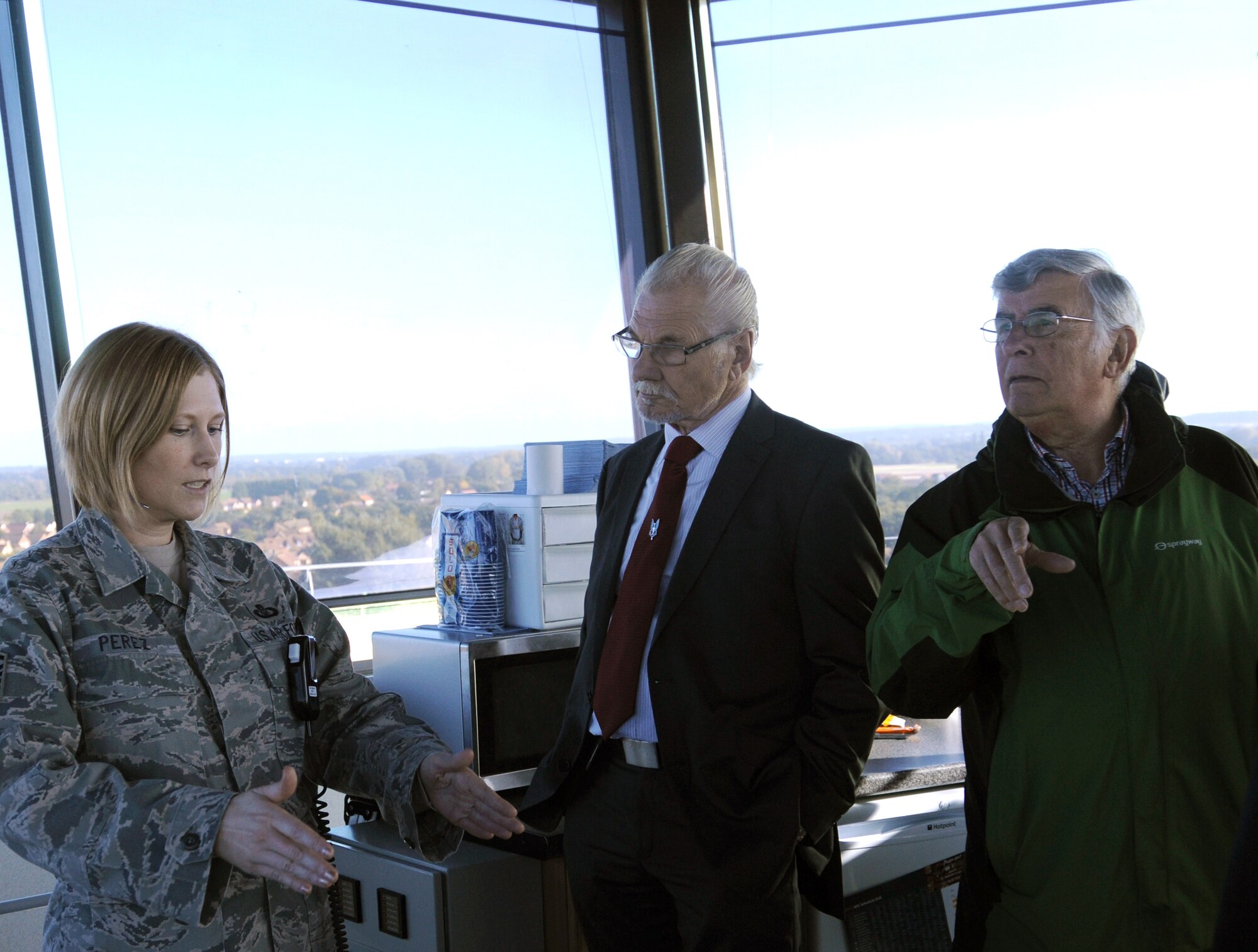 Master Sgt. Jennifer Perez, 100th Operations Support Squadron tower watch supervisor, briefs members of the Friends of the Imperial War Museum Duxford on air traffic control tower operations during a base tour Oct. 9, 2012, at RAF Mildenhall, England. The tour was conducted by members of the 100th OSS for the friends of the museum as well as for Adam Kendall, the 100th OSS honorary commander, and went to several 100th OSS areas of operation.  (U.S. Air Force photo by Tech. Sgt. Neal X. Joiner/Released) 
