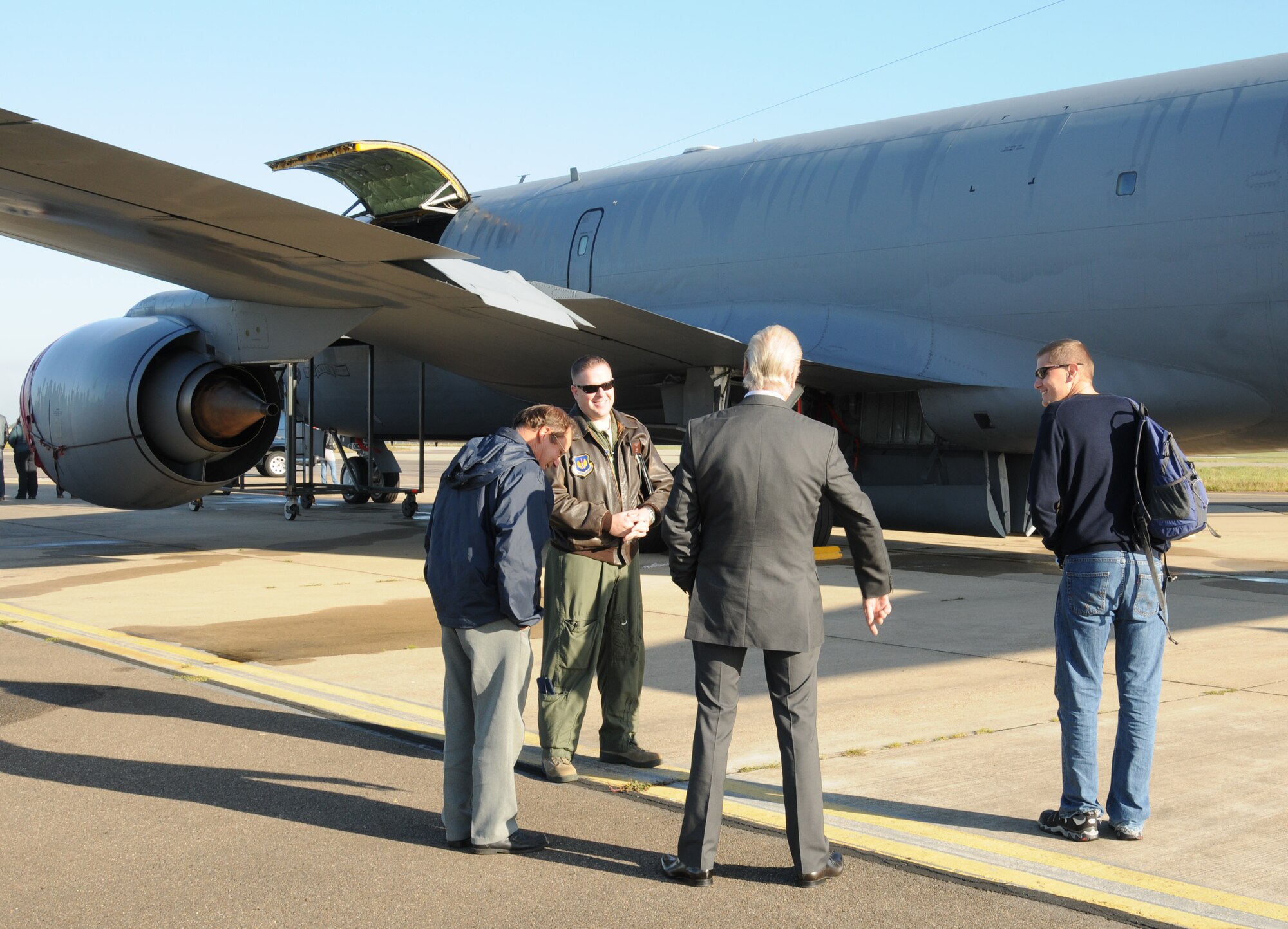 Maj. Daniel Hale, 100th Operations Support Squadron assistant director of operations, briefs Friends of the Imperial War Museum Duxford on the capabilities of a KC-135 Stratotanker aircraft during a base tour Oct. 9, 2012, at RAF Mildenhall, England. The tour was conducted by members of the 100th OSS for the friends of the museum as well as for Adam Kendall, the 100th OSS honorary commander. They visited an aircraft display, the base tower and ate lunch at the Galaxy Club. (U.S. Air Force photo by Tech. Sgt. Neal X. Joiner/Released)