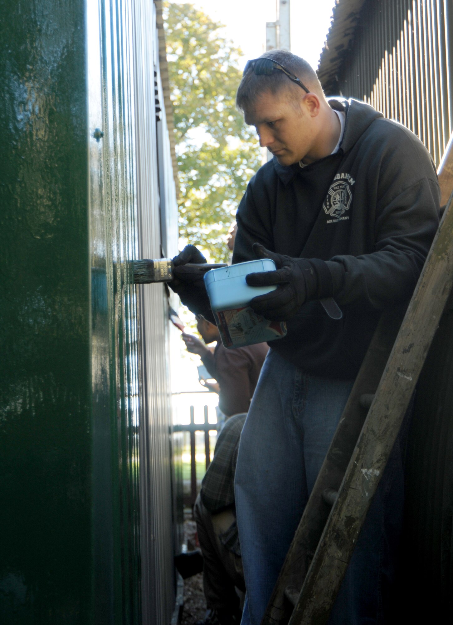 Tech. Sgt. Lewis Squires, 100th Civil Engineer Squadron, paints a shed at Thorpe Abbotts Memorial Museum Oct. 6, 2012, near Diss, England. Squires and other members of the 100th CES Top IV volunteered at the museum, which honors the 100th Bombardment Group’s service at Thorpe Abbotts during World War II. (U.S. Air Force photo by Tech. Sgt. Neal X. Joiner/Released)