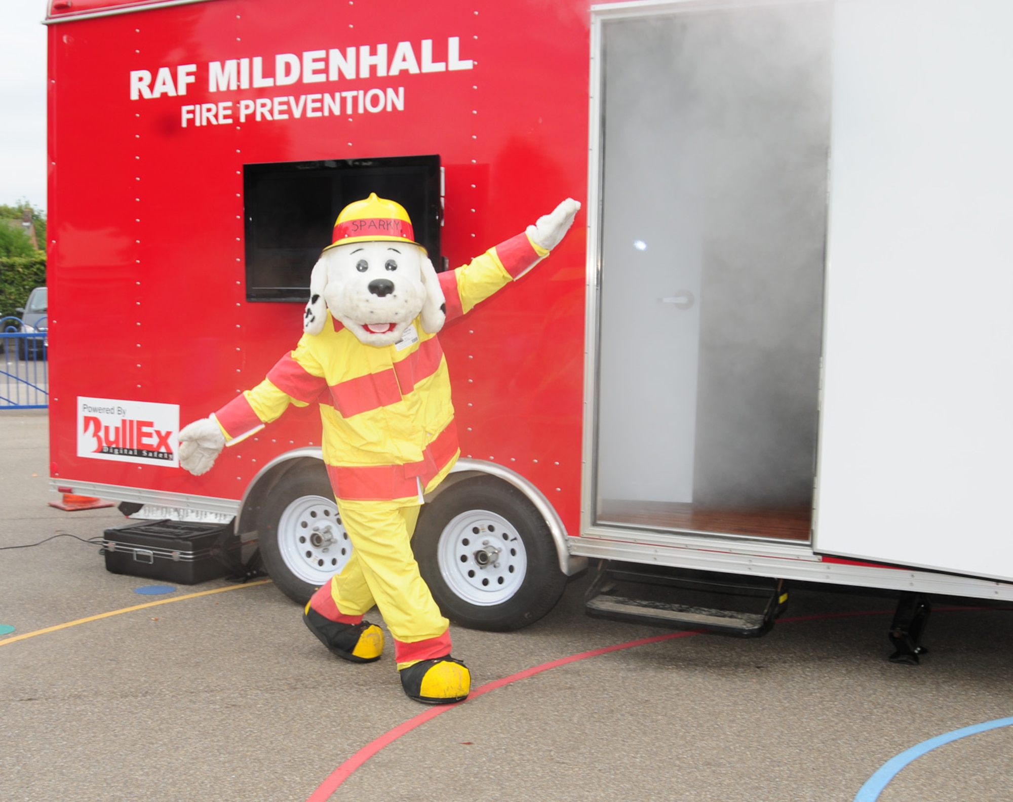 Sparky the Fire Dog greets children at St. Mary's Academy in Mildenhall, England, Oct. 8, 2012. Firefighters from RAF Mildenhall visited the school as part of Fire Prevention Week. Other events include a Fire Muster Oct. 11 and the fire department Open House Oct. 12. (U.S. Air Force photo/Karen Abeyasekere)