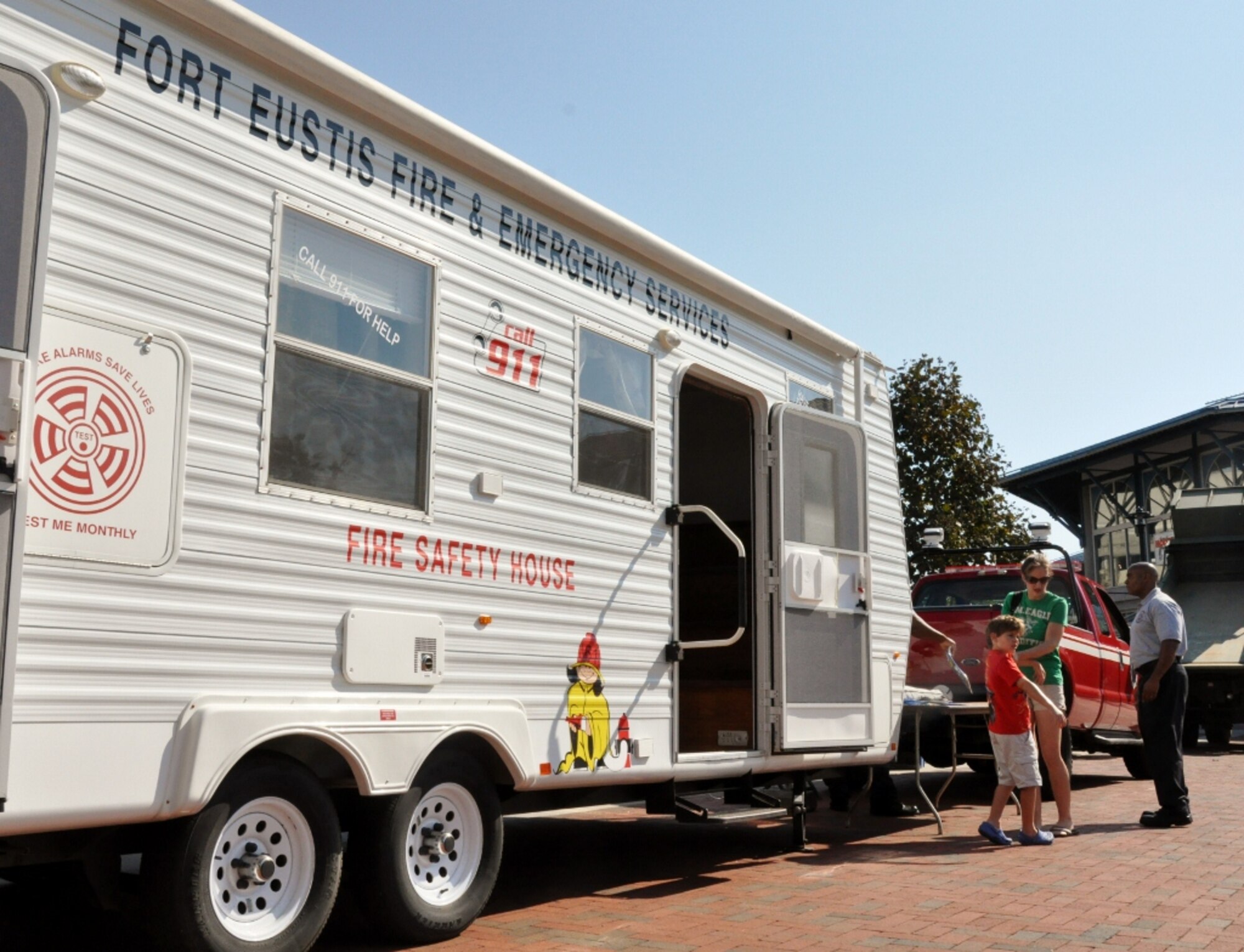 The Fort Eustis Fire Department provided fire safety tours inside their fire safety house trailer at the Norfolk Children's Festival at Town Point Park in downtown Norfolk, Va., Oct. 6, 2012. The custom trailer features a mock-up of the inside of a home, providing a glimpse into where house fires can start, and how to avoid them. (U.S. Air Force photo by Senior Airman Jason J. Brown/Released)