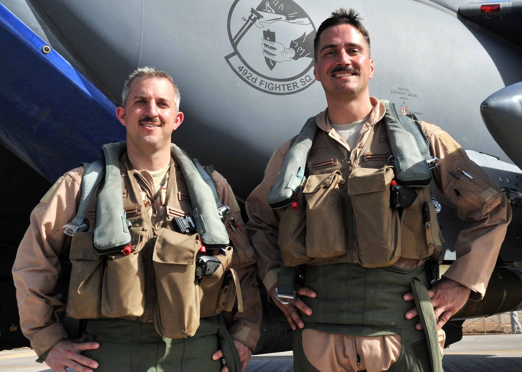 Capt. William Johnson, left, and Maj. Daniel Spier, assigned to the 492nd Fighter Squadron, Royal Air Force Lakenheath, U.K., received the Aviation Well Done Award for outstanding airmanship and professional performance during a hazardous situation and for a significant ocntribution to the Air Force Mishap Prevention Program. (U.S. Air Force photo)