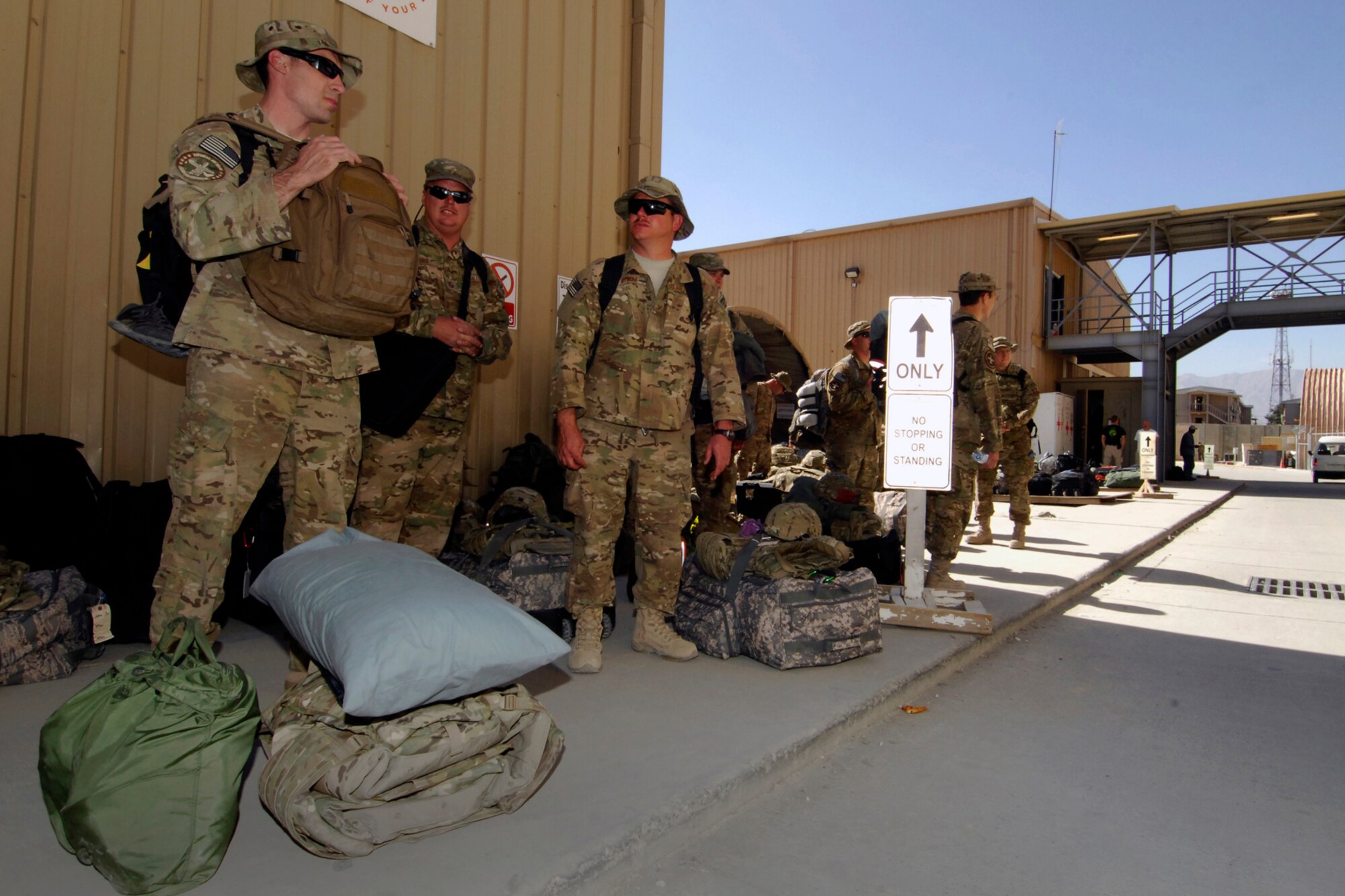 Aircraft maintainers assigned to the 455th Expeditionary Aircraft Maintenance Squadron wait at the passenger terminal for a departing flight for home from Bagram Airfield, Afghanistan, Oct. 3, 2012. The A-10 maintainers from Arkansas and Maryland recently headed home to their respective Air National Guard units. (U.S. Air Force photo/SSgt Jeff Nevison)
