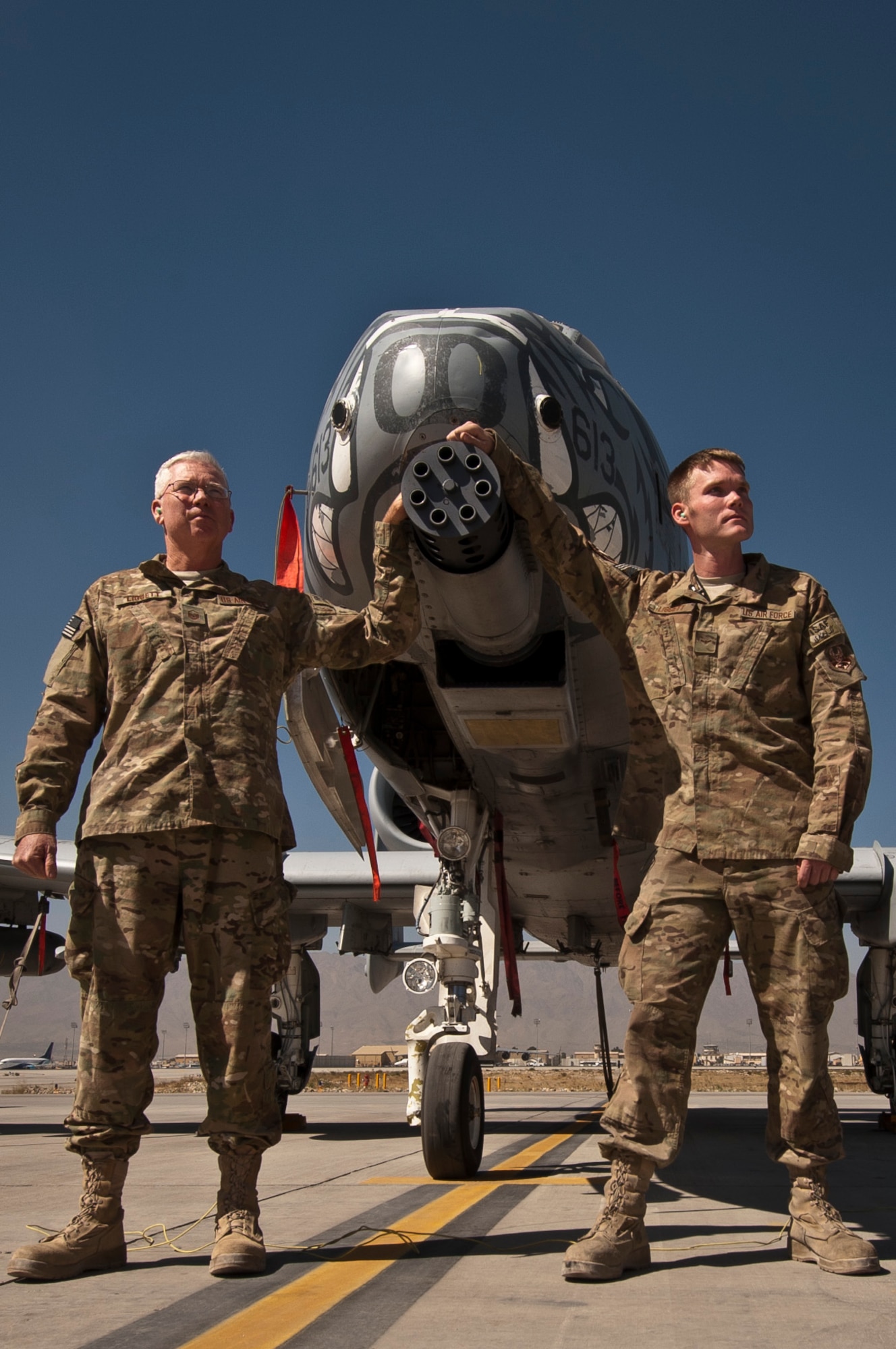 MSgt William Liggett and his son, A1C Sean Liggett, maintainers deployed together to the 455th Expeditionary Aircraft Maintenance Squadron, stand in front of a U.S. Air Force A-10 Thunderbolt II at Bagram Airfield, Afghanistan, Oct. 3, 2012. The father and son team began their journey home this week after successfully completing their deployment with the 455th Air Expeditionary Wing. (U.S. Air Force Photo/Capt. Raymond Geoffroy)
