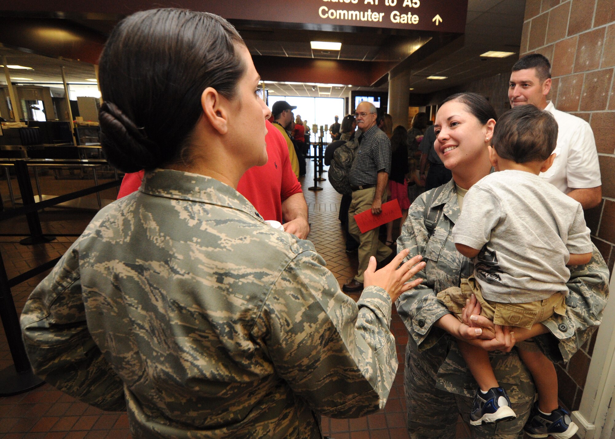 Senior Master Sgt. Janice Eadie is greeted by Lt. Col. Heather McCue Oct. 6, 2012 after returning home from a six-month deployment to Southwest Asia. Eadie is one of more than 60 deployed Airmen from the 315th Airlift Wing who were responsible for cargo and passenger operations at their deployed locations. Eadie is a load planning specialist with the 81st Aerial Port Squadron and McCue is the 81 AP commander. (U.S. Air Force Photo/Staff Sgt. Shane Ellis)