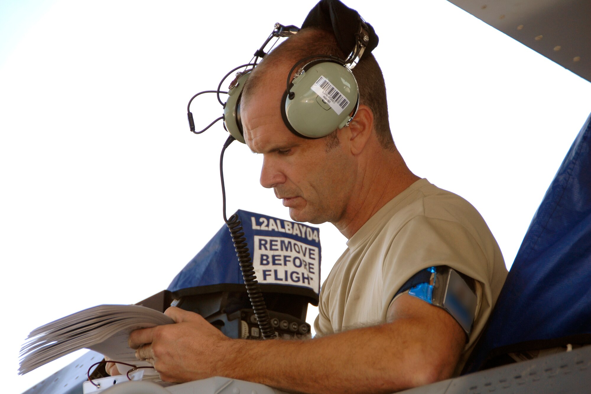 Senior Master Sgt. Brian Norris, a weapons inspector assigned to AFNORTH/1AF from Tyndall Air Force Base, Fla., evaluates a 169th Fighter Wing's weapons load team during a weapons reliability check, Sept. 26, 2012.  The McEntire team consists of Master Sgt. Jeremy Pow (pictured), team leader, and Senior Airmen Steven Hollis and Carlos Graham, all assigned to the 169th Fighter Wing's Aerospace Control Alert unit.  McEntire Joint National Guard Base's Aerospace Control Alert mission receives an Alert Force Operational Assessment (AFOA) inspection from 1AF/AFNORTH to evaluate its ability to provide for our nation's homeland defense.  McEntire is home of the Swamp Foxes of the South Carolina Air National Guard and the 169th Fighter Wing.