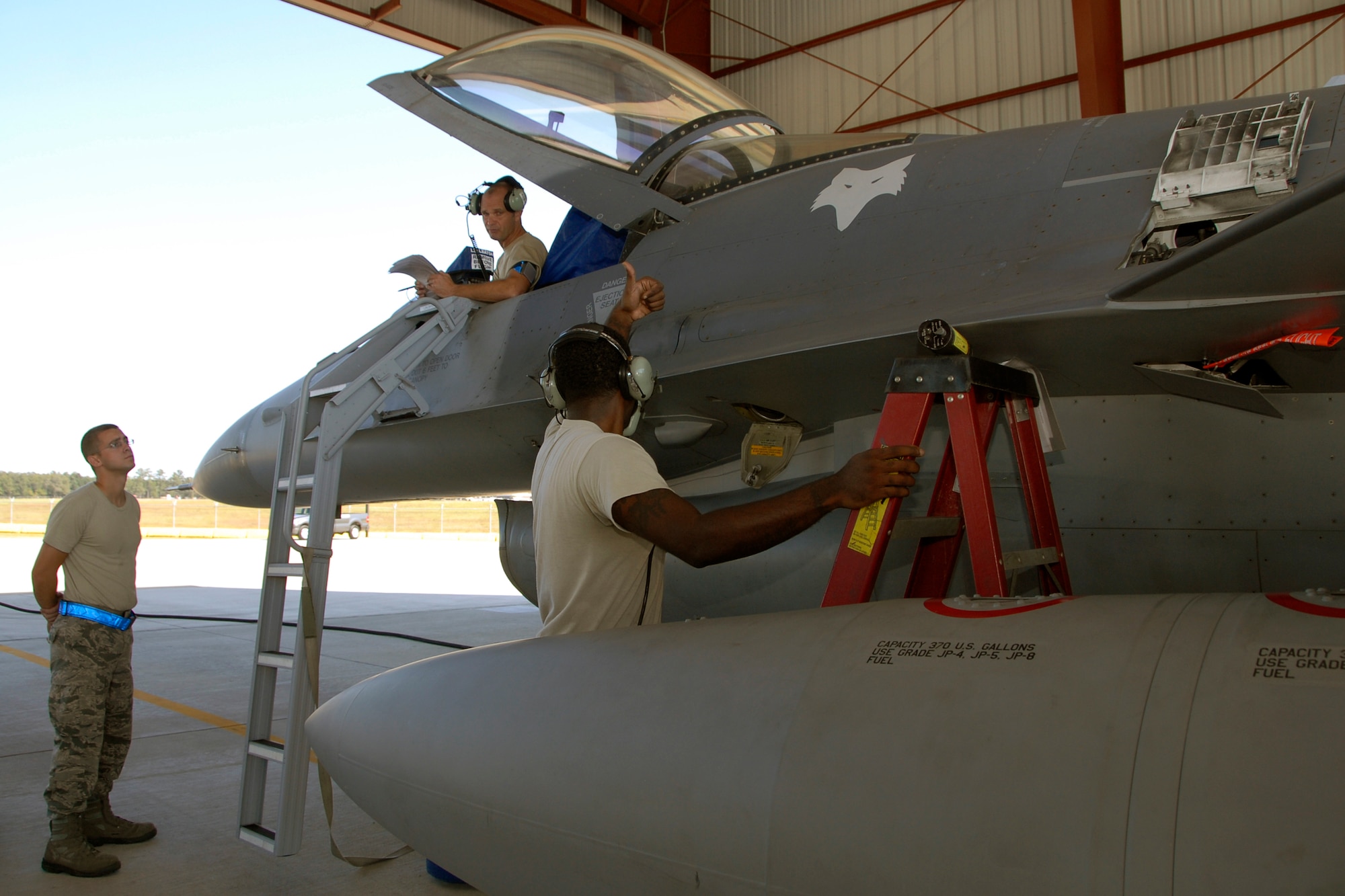 Senior Master Sgt. Brian Norris, a weapons inspector assigned to AFNORTH/1AF from Tyndall Air Force Base, Fla., evaluates a 169th Fighter Wing's weapons load team during a weapons reliability check, Sept. 26, 2012.  The McEntire team consists of Master Sgt. Jeremy Pow, team leader, and Senior Airmen Steven Hollis and Carlos Graham, all assigned to the 169th Fighter Wing's Aerospace Control Alert unit.  McEntire Joint National Guard Base's Aerospace Control Alert mission receives an Alert Force Operational Assessment (AFOA) inspection from 1AF/AFNORTH to evaluate its ability to provide for our nation's homeland defense.  McEntire is home of the Swamp Foxes of the South Carolina Air National Guard and the 169th Fighter Wing.