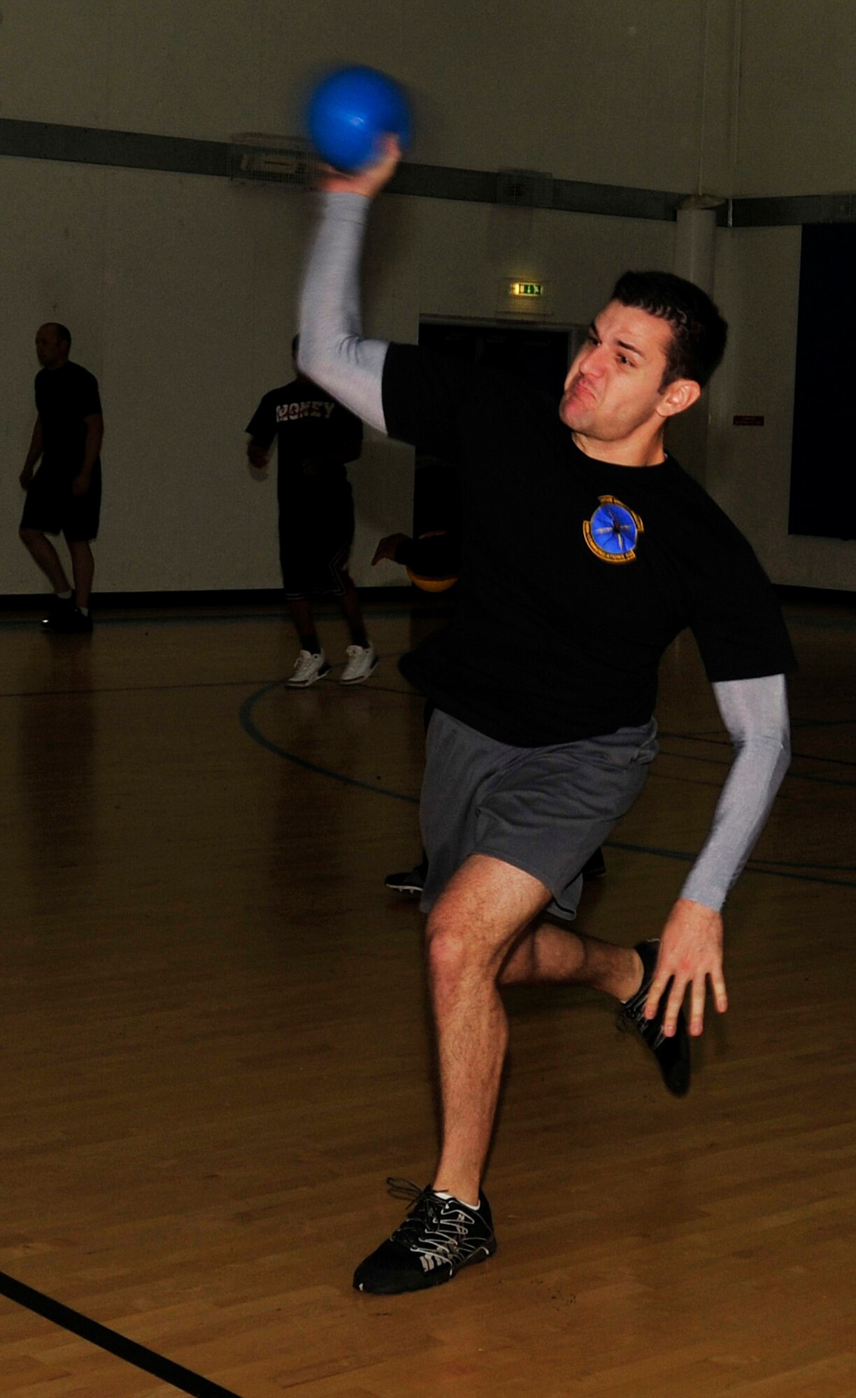 ROYAL AIR FORCE LAKENHEATH, England - Tech. Sgt. Scott Ponte, 48th Communication Squadron airfield systems technician, throws a ball during a dodgeball game against the 100th CS at the fitness center Oct. 5, 2012. The two squadrons gathered for a day of friendly competition in kickball, ultimate frisbee, dodgeball and other activities. (U.S. Air Force photo by Senior Airman Tiffany M. Grigg)