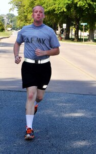 U.S. Army Spc. James Conklin, a Soldier assigned to the 597th Transportation Brigade, runs along the roadways at Fort Eustis, Va., Oct. 5, 2012. Conklin will test his physical and mental skills against the Army's top Soldiers in areas including warrior tasks and battle drills, field tactics, fitness, board interviews, written exams, marksmanship and urban warfare during the Best Warrior competition at Fort Lee, Va., Oct. 15-18. (U.S. Army photo by Michelle Montieth/Released)