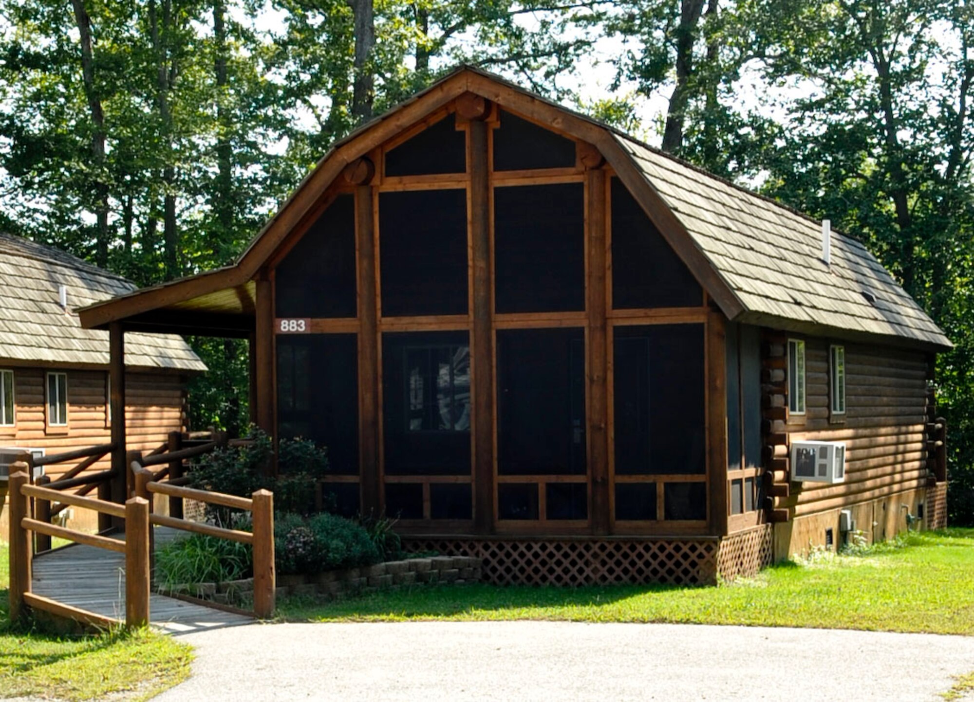 Fort Eustis' Outdoor Recreation rents five log cabins, nestled against the woods and nearby Eustis Lake, that offer the quaintness of mountain living with the convenience of their location on the installation. Wrap-around porches overlook the lake, and each cabin is appointed with all the furniture, modern appliances and bedding needed to enjoy a quiet weekend away without leaving the state. (U.S. Air Force photo by Staff Sgt. Wesley Farnsworth/Released)