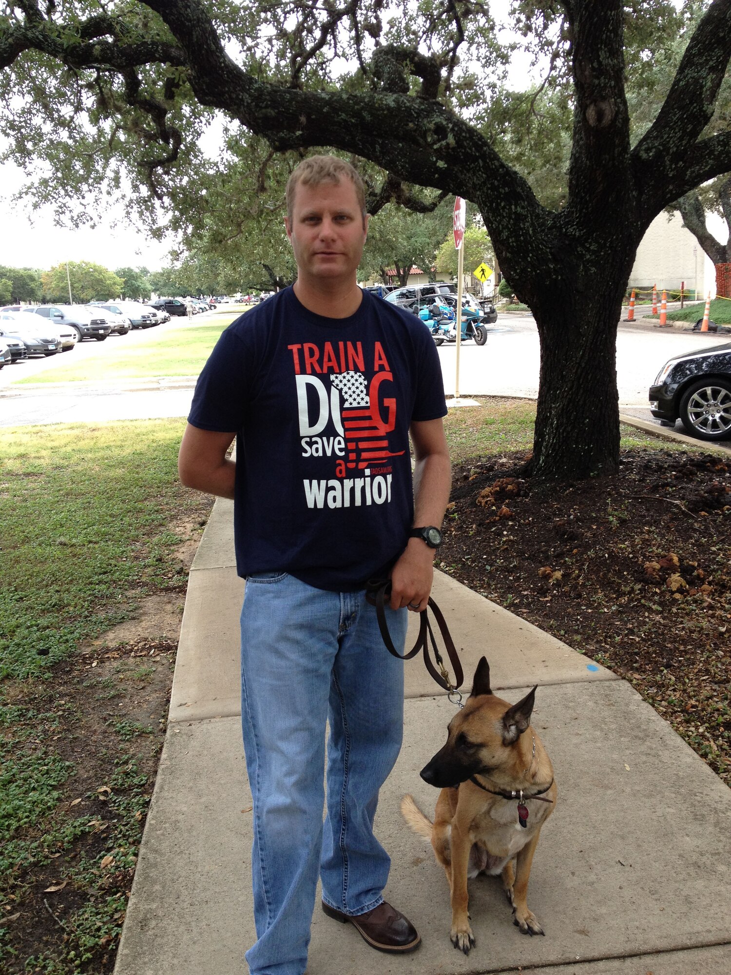 Staff Sgt. Andrew Goligowski, an Air Force wounded warrior struggling with post-traumatic stress and the pain caused by sarcoidosis, has a service dog, Mali, to help him cope.  Goligowski received Mali through the Train A Dog – Save A Warrior program. (U.S. Air Force photo/Scott Hand) 