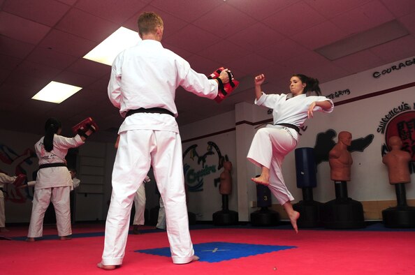 Aerial Vineyard, 15, performs a jumping roundhouse kick during her karate practice in Goldsboro, N.C., Oct. 2, 2012. The karate student earned two gold and one silver medal competing against other students from around the United States at this year’s Junior Olympics. Aerieal is the daughter of Tech. Sgt. Michael Vineyard, 335th Aircraft Maintenance Unit flight line expeditor. (U.S. Air Force photo/Airman 1st Class Aubrey Robinson/Released)