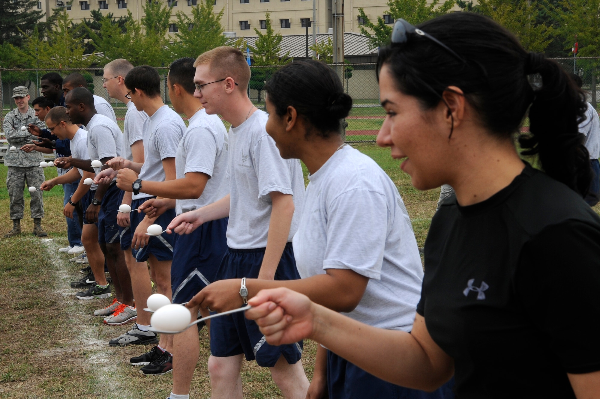 NCOs and Airmen from the 8th Fighter Wing wait to begin an egg race during Airman Appreciation Day Oct. 5, 2012, at Kunsan Air Base, Republic of Korea. Team 5/6 hosted the day to show their appreciation for Airmen’s hard work and dedication to the mission. (U.S. Air Force photo/Senior Airman Marcus Morris)