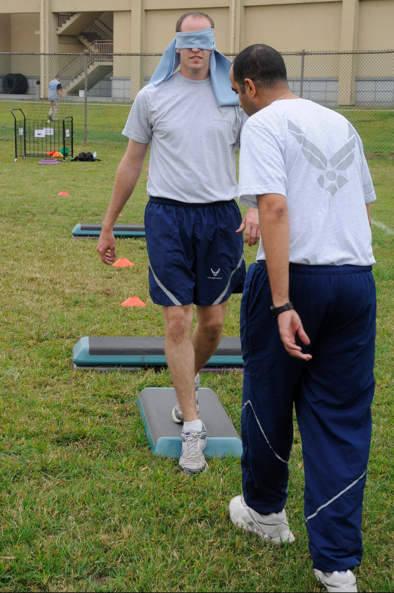 An NCO from the 8th Fighter Wing verbally guides a blindfolded Airman around an obstacle course during Airman Appreciation Day Oct. 5, 2012, at Kunsan Air Base, Republic of Korea. The day also featured a 3-legged race and a kickball game. (U.S. Air Force photo/Senior Airman Marcus Morris) 