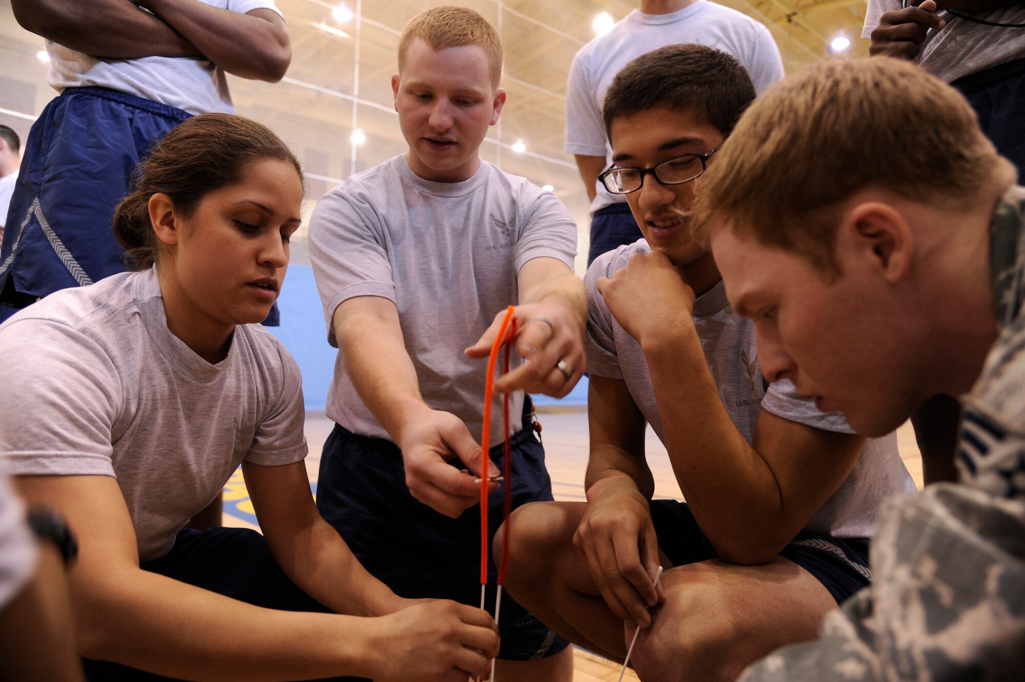 Wolf Pack members attempt to build the tallest structure for a team-building activity during Airman Appreciation Day Oct. 5, 2012, at Kunsan Air Base, Republic of Korea. Along with games, the day featured mentoring sessions including “There is no ‘I’ in team” and “Tips for success” led by senior NCOs. (U.S. Army photo/Sgt. Jose Ramirez)