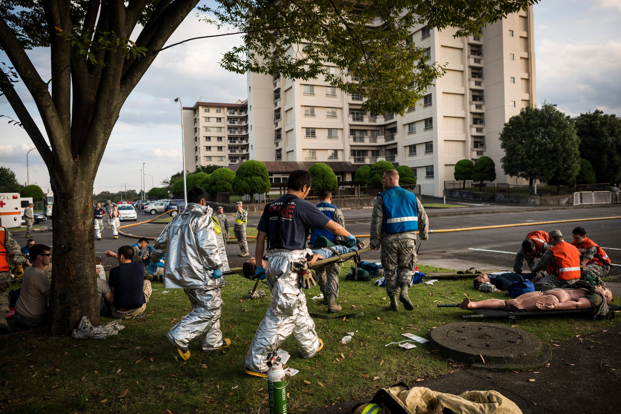 YOKOTA AIR BASE, Japan -- First responders carry a simulated victim during an emergency management exercise at Yokota Air Base, Japan, Oct. 5, 2012. Whenever possible, live role players were used to increase the sense of realism, but some practice dummies were used in situations where a live role player was impractical. (U.S. Air Force photo by Tech. Sgt. Samuel Morse)