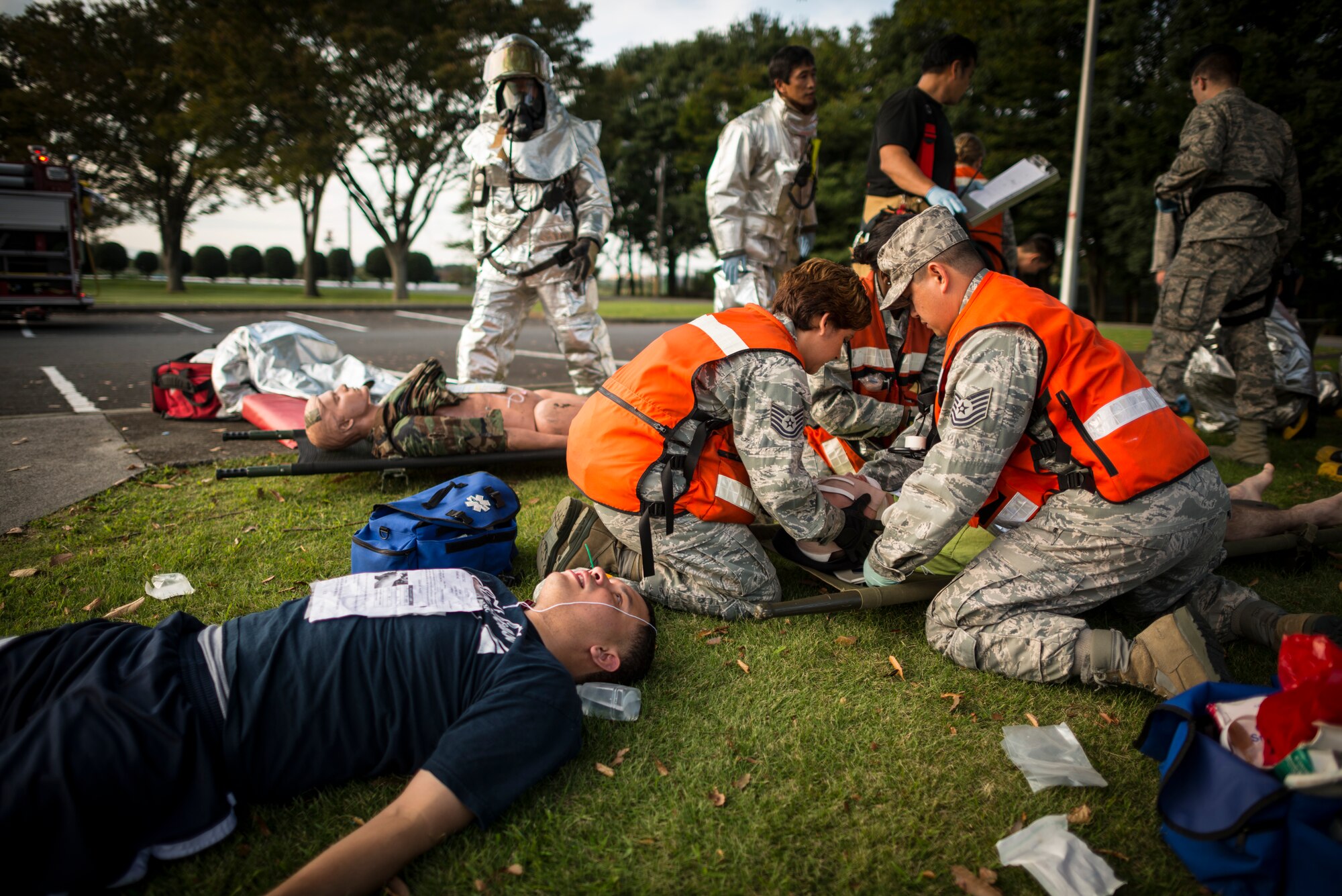 YOKOTA AIR BASE, Japan -- First responders from the 374th Medical Group tend to simulated victims during an emergency management exercise at Yokota Air Base, Japan, Oct. 5, 2012. The exercise tested first responders' ability to work as a team to handle an emergency scenario. (U.S. Air Force photo by Tech. Sgt. Samuel Morse)