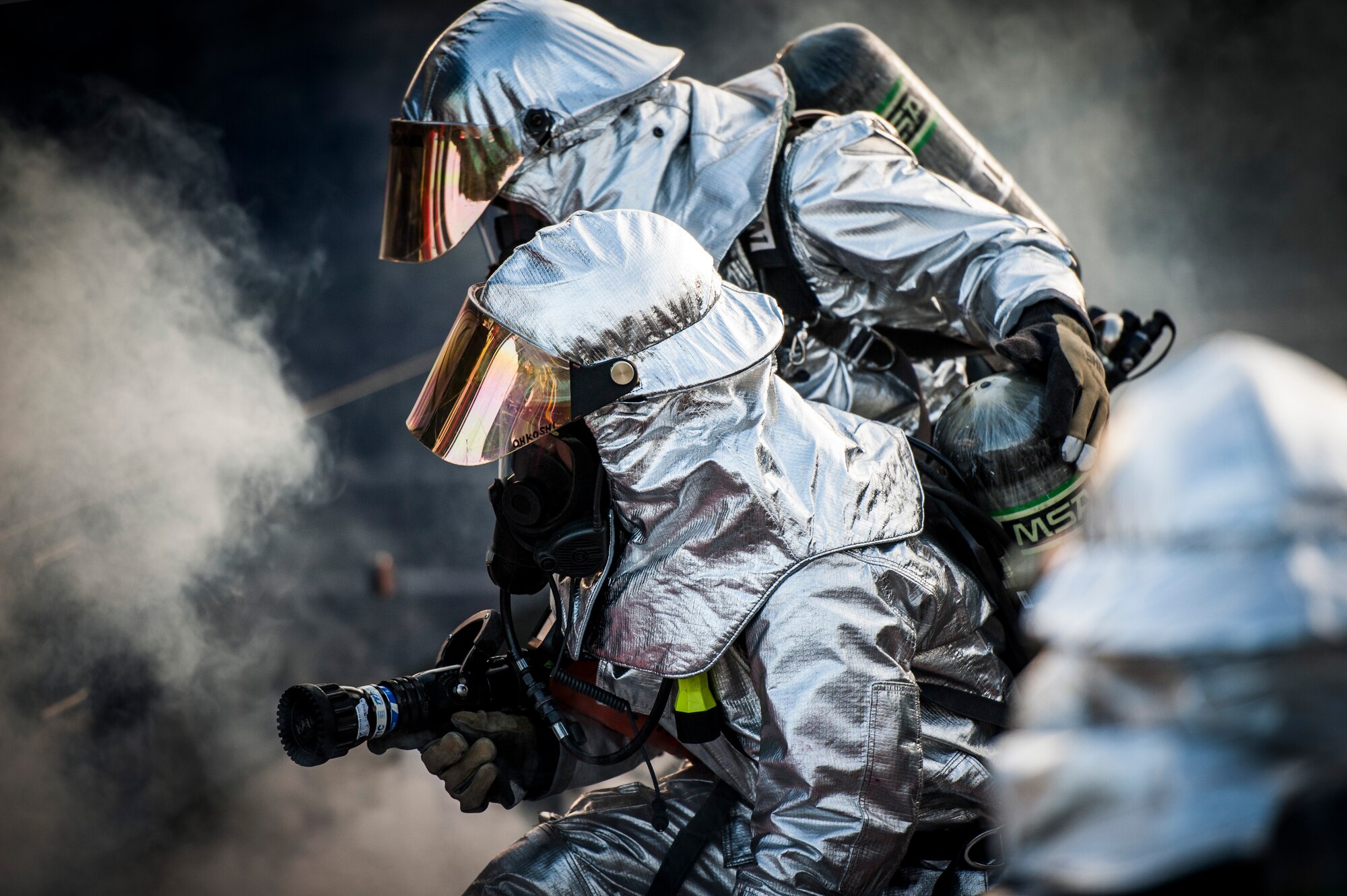 YOKOTA AIR BASE, Japan -- Firefighters from the 374th Civil Engineer Squadron respond to a simulated bus fire during an emergency management exercise at Yokota Air Base, Japan, Oct. 5, 2012. In addition to regular base-wide exercises, first responders often exercise together to make their response as seamless as possible. (U.S. Air Force photo by Tech. Sgt. Samuel Morse)