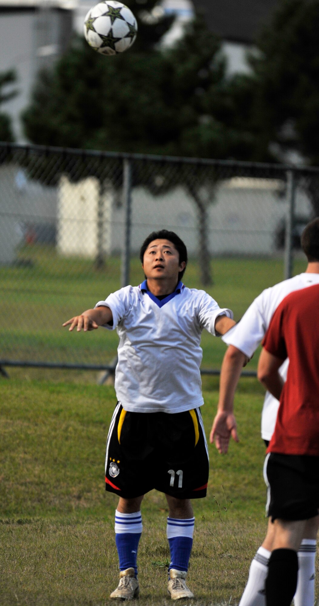 Hayami Kawaguchi, 35th Logistics Readiness Squadron soccer team member, throws the ball in during the intramural soccer championship at Misawa Air Base, Japan, Oct. 7, 2012. Despite leading the majority of the game, the 35th Aircraft Maintenance Squadron lost this close battle to the 35 LRS 2-1 in the closing minutes of the match. (U.S. Air Force photo by Airman 1st Class Zachary Kee)