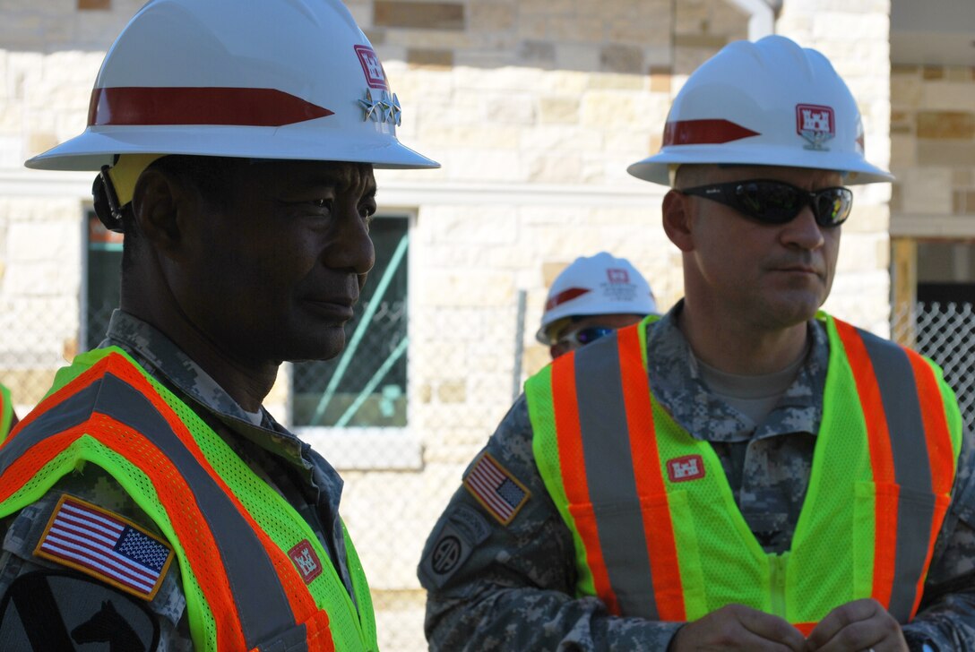 Lieutenant General Thomas P. Bostick, Chief of Engineers, and Col. Charles H. Klinge, Jr., commander, Fort Worth District listen to a briefing outside the Fort Hood Chapel.