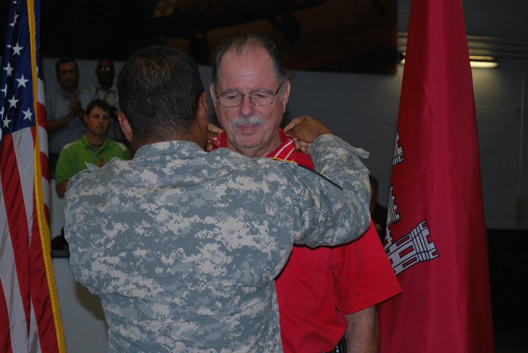 Gen. Thomas P. Bostick, Chief of Engineers, presents Wayne Carter, San Antonio Area Office with the Bronze de Fleury Medal for his exceptional service to the entire Army Engineer regiment throughout his military and civilian career during a town hall meeting held on Joint Base San Antonio - Fort Sam Houston September 26.